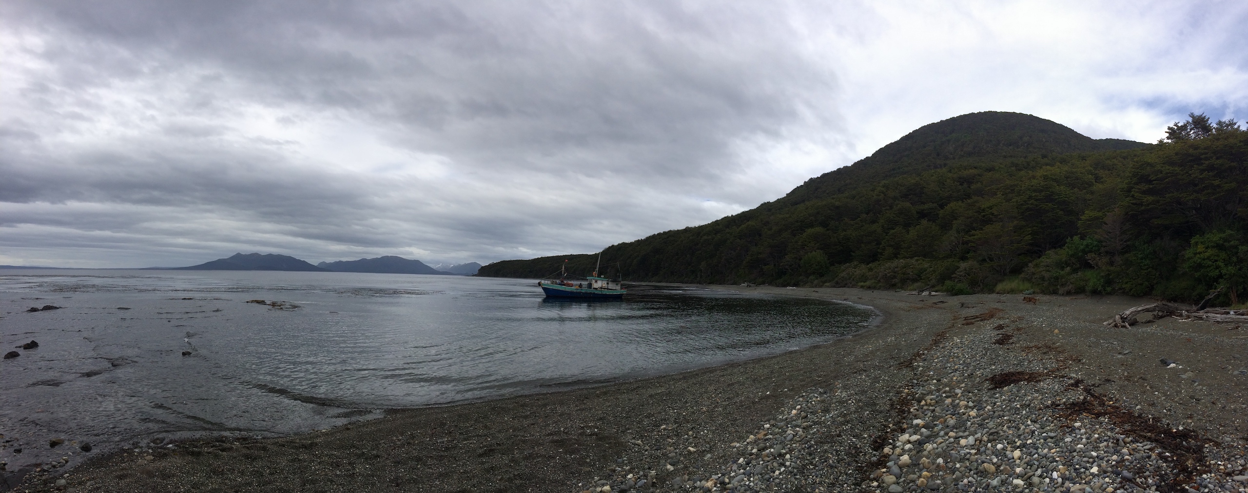 Photograph of a fishing boat in a lonely bay on the Strait of Magellan